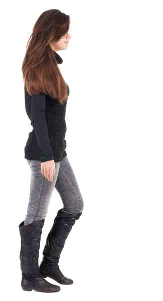 Back view of going woman in jeans and sweater — Stock Photo, Image