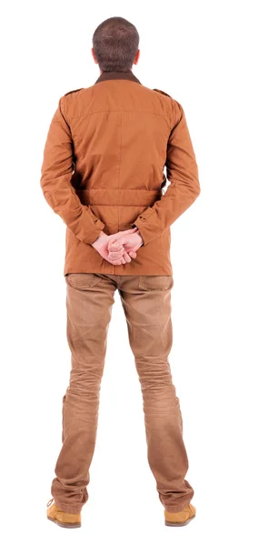 Vista posterior de hombre elegantemente vestido en un marrón jackett buscando u — Foto de Stock