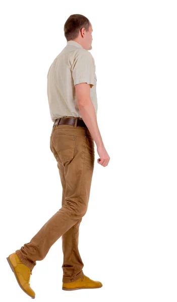 Vista trasera de un hombre guapo en jeans y una camisa . — Foto de Stock