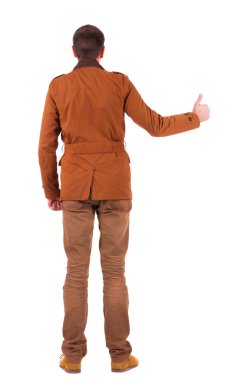 başparmak ceketli adamı arkadan görünüm gösterir