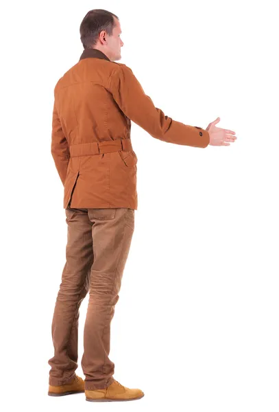 Back view of business man in jacket out to shake hands. — Stock Photo, Image