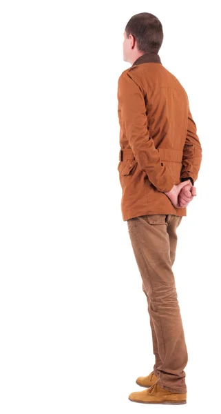 Bakifrån av fundersam snygg man i en brun jacka. — Stockfoto