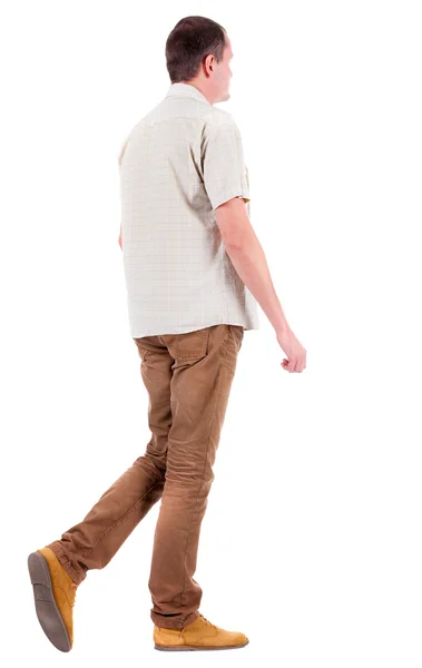 Visão de homem bonito em jeans marrons e uma camisa de volta. — Fotografia de Stock