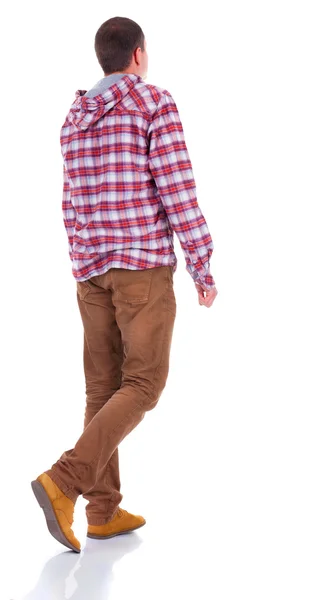 Back view of walking teenager in plaid shirt with hood — Stock Photo, Image