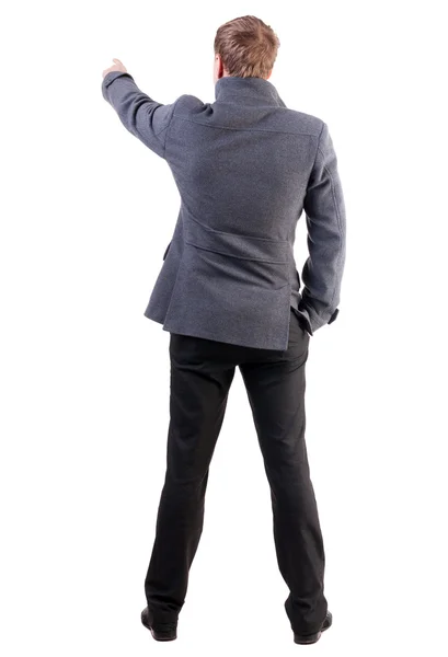 Back view of pointing young business men in coat — Stock Photo, Image