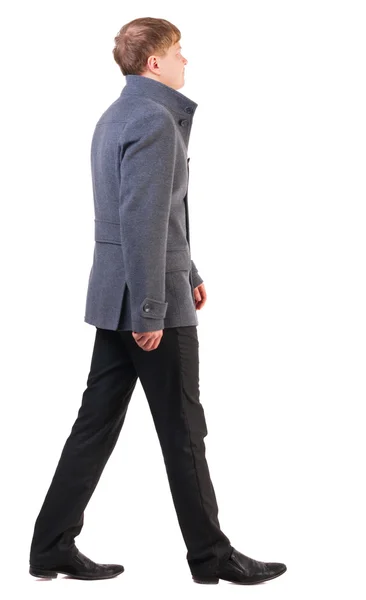 Back view of going handsome business man in coat — Stock Photo, Image