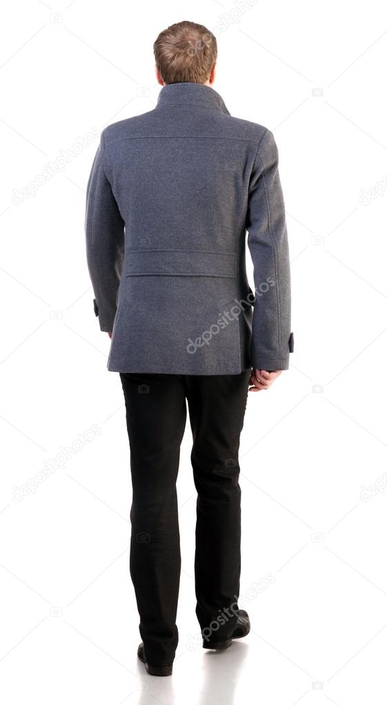 Back view of going stylishly dressed business man in gray coat