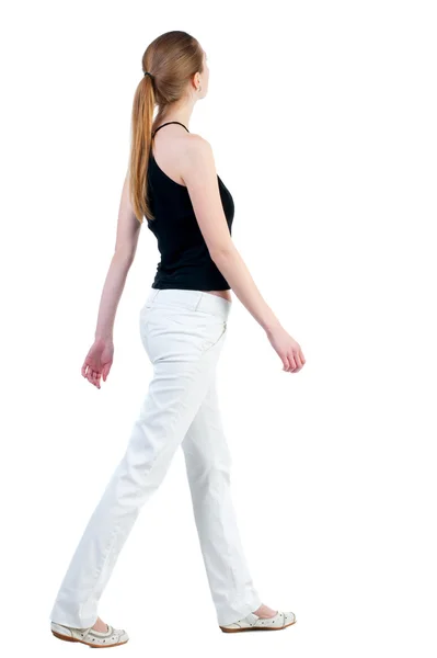 Pohled zezadu na chodící žena — Stock fotografie