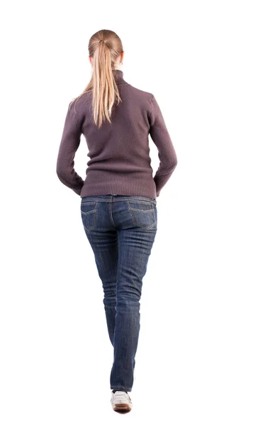 Back view of walking woman in sweater — Stock Photo, Image