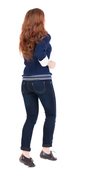 Back view of jumping woman in jeans — Stock Photo, Image