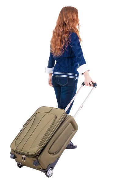 Back view of walking woman with suitcase — Stock Photo, Image