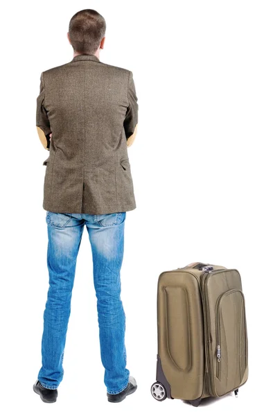 Вид сзади путешествия бизнеса человек с чемоданом — стоковое фото