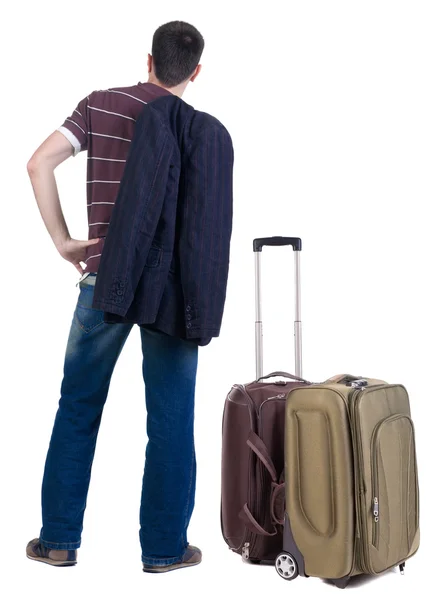 Bakifrån av resande grundskola man med resväska — Stockfoto