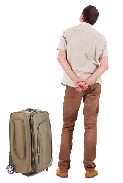 Bakifrån av resande grundskola man med resväska — Stockfoto