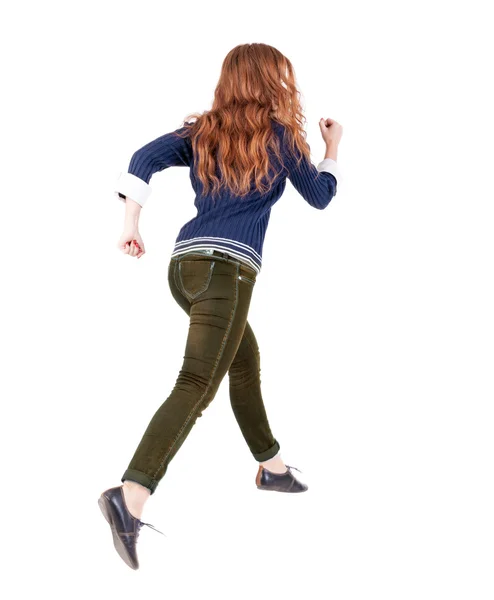 Back view of jumping woman in jeans. — Foto de Stock