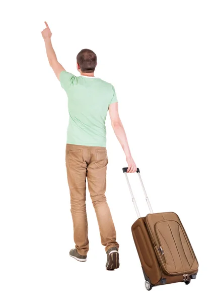 Back view of walking man with suitcase. — Stock Photo, Image