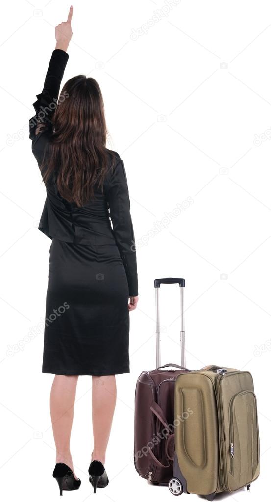 Back view of traveling business woman with suitcas