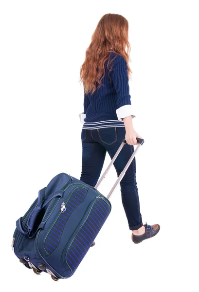 Achteraanzicht van het lopen vrouw met koffer — Stockfoto