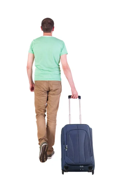 Vista di camminare l'uomo con la valigia posteriore. — Foto Stock