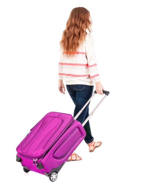 Vista di camminare la donna con la valigia posteriore. — Foto Stock