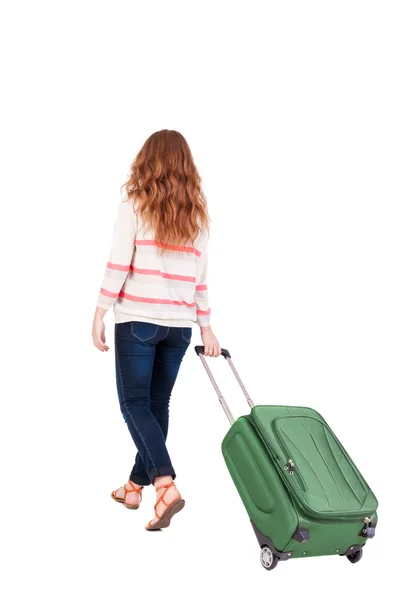 Achteraanzicht van het lopen vrouw met koffer. — Stockfoto