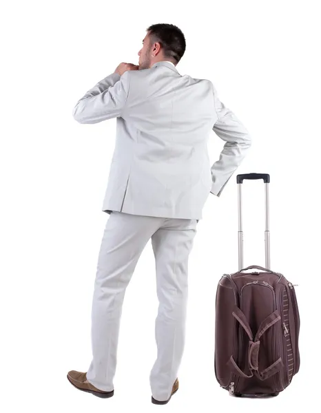Widok człowiek biznesu z walizką podróżujących z tyłu — Zdjęcie stockowe