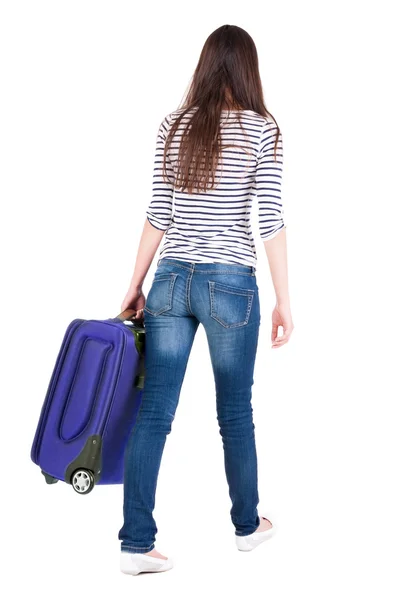 Vue de la femme avec la valise de marche arrière. — Photo