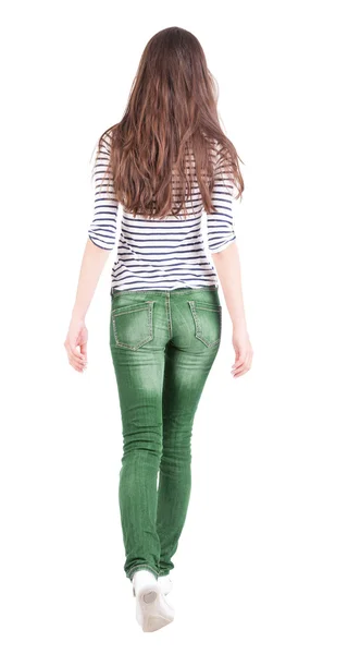 Back view of walking woman in jeans . — Stock Photo, Image