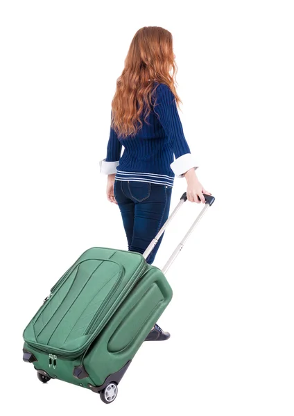 Back view of walking woman with suitcase — Stock Photo, Image