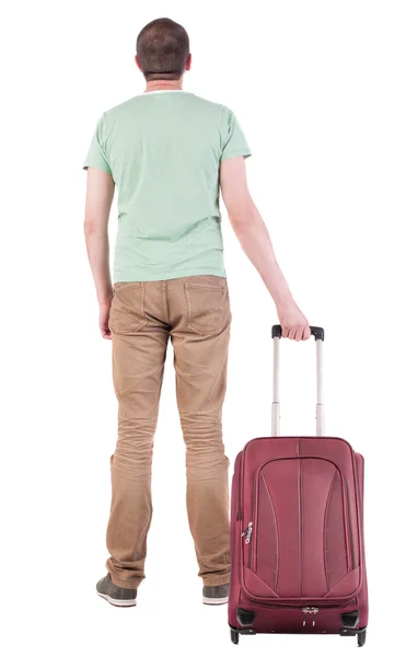 Back view of man with suitcase looking up — Stock Photo, Image