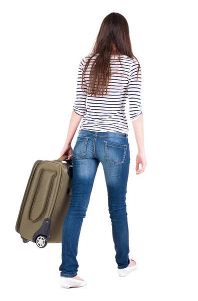 Back view of walking woman with suitcase. — Stock Photo, Image