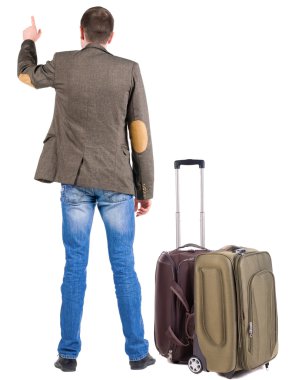 Arkadan görünüş-seyahat bavul işaret ile iş adamı.