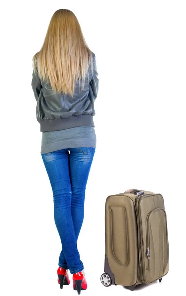 Szőke nő keresi fel bőrönddel hátulnézete. — Stock Fotó