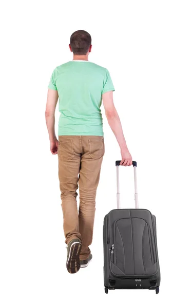 Vista posterior de caminar hombre con maleta. —  Fotos de Stock