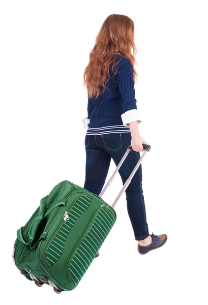 Achteraanzicht van het lopen vrouw met koffer — Stockfoto