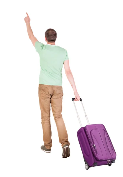 Back view of walking man with suitcase. — Stock Photo, Image