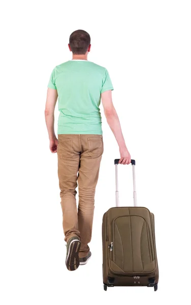 Înapoi vedere de mers pe jos om cu valiză . — Fotografie, imagine de stoc