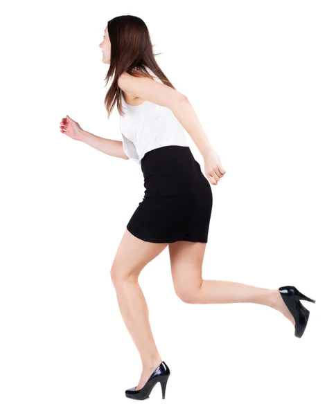 Back view of running woman in dress. — Stock Photo, Image