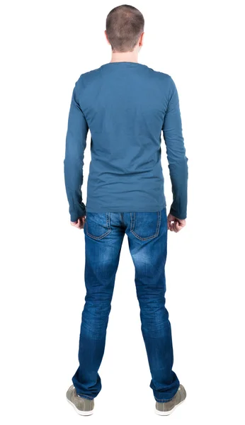 Rückansicht des junger Mann in T-shirt und Jeans, die auf der Suche. — Stockfoto