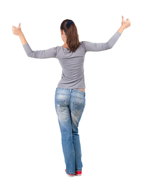 Back view of woman thumbs up. Stock Picture