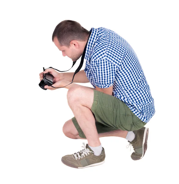 Back view of man photographing. photographer in shorts — Stock Photo, Image