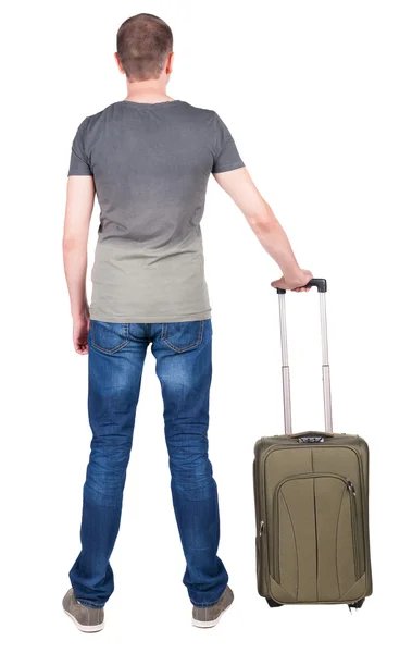 Back view of man with green suitcase looking up. — Stock Photo, Image