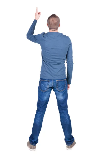 Задний вид указания молодых людей в рубашке и джинсах . — стоковое фото