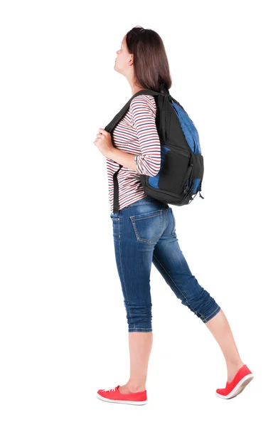 Back view of standing young beautiful brunette woman with backp — Stock Photo, Image