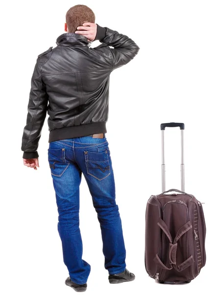 Visão do homem a viajar com mala olhando de volta. — Fotografia de Stock