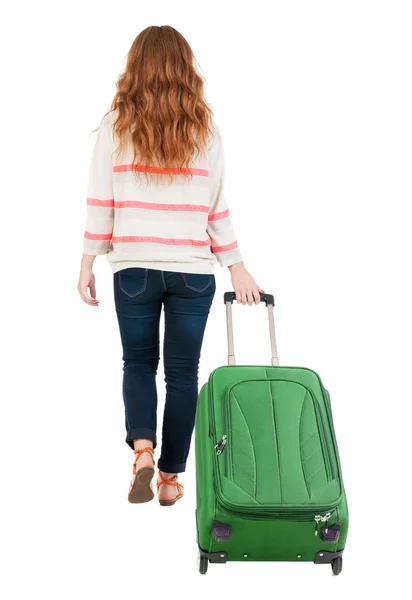 Achteraanzicht van het lopen vrouw met koffer. — Stockfoto