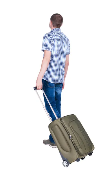 Back view of man with green suitcase looking up. — Stock Photo, Image