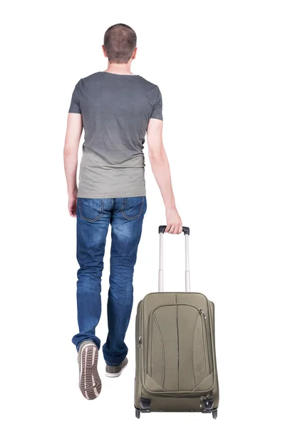 back view of walking man with suitcase.