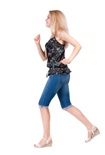 Achteraanzicht van lopende vrouw. prachtige blond meisje in beweging. — Stockfoto
