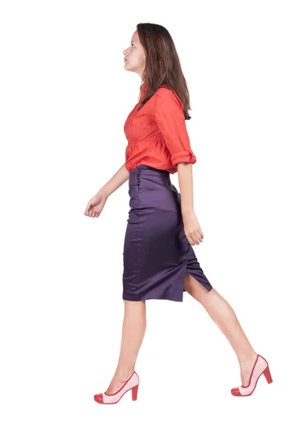 Back view of walking woman in dress . Stock Photo